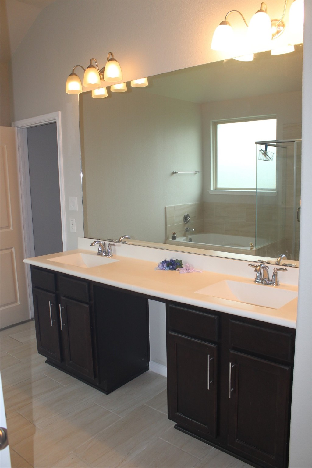 14200 Wallowa Ridge Lane Conroe, TX 77384 - Photo 13 of 22 a bathroom with a sink double vanity and a mirror
