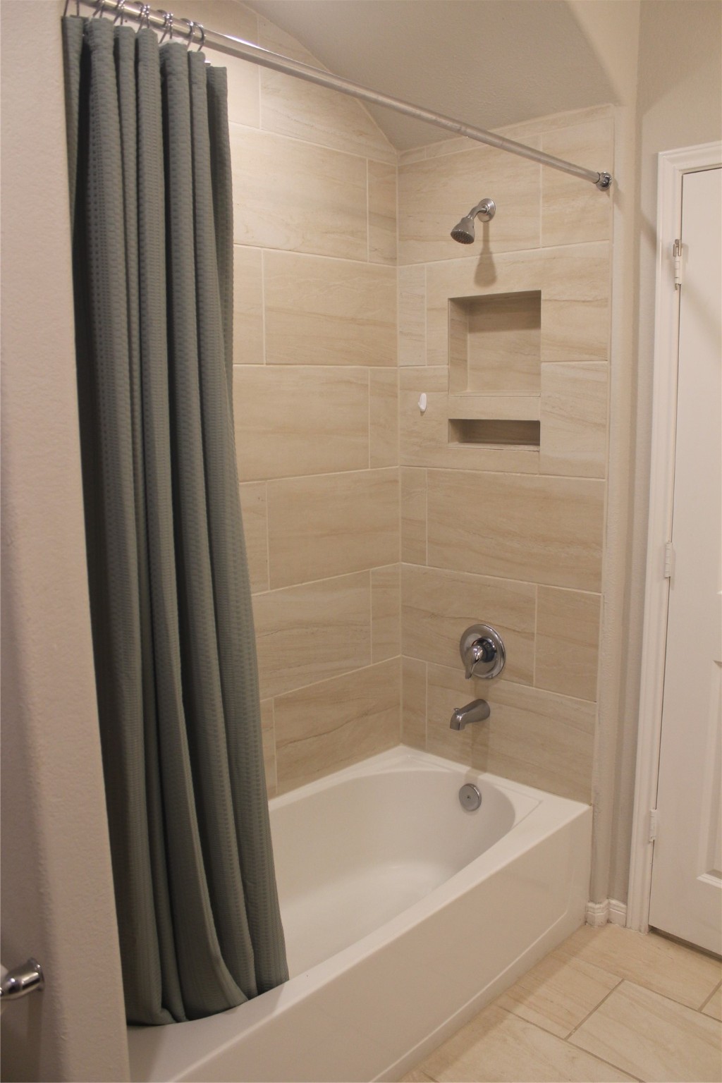 14200 Wallowa Ridge Lane Conroe, TX 77384 - Photo 14 of 22 a bathroom with bathtub and shower