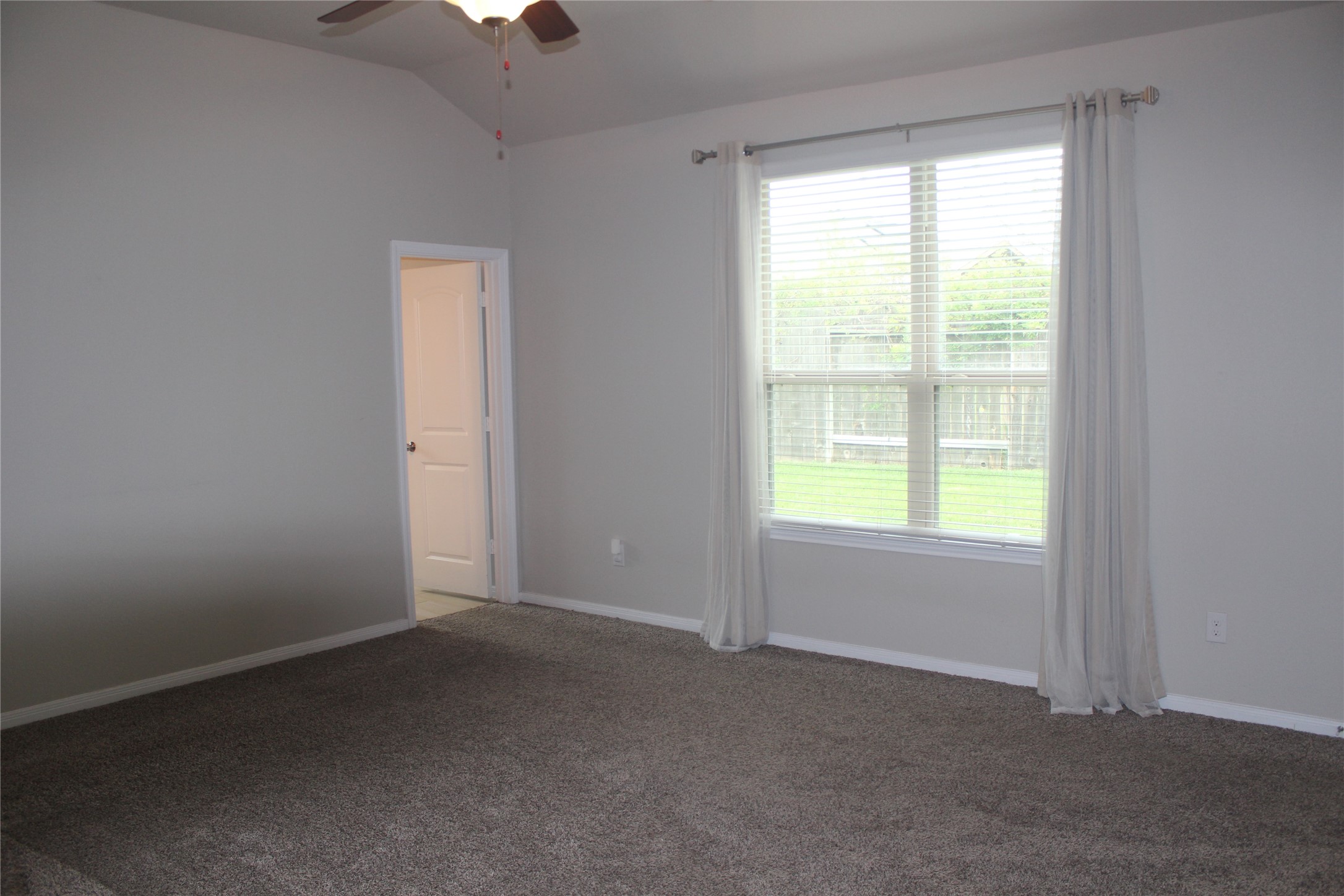 14200 Wallowa Ridge Lane Conroe, TX 77384 - Photo 10 of 22 a view of an empty room with a window