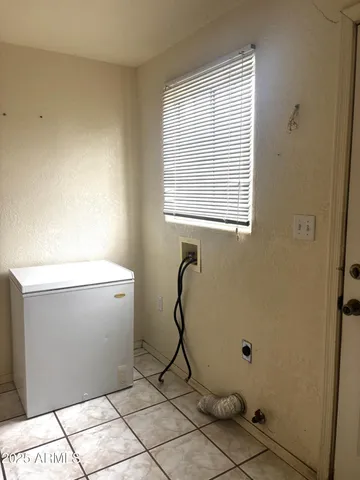 a white toilet sitting next to a window