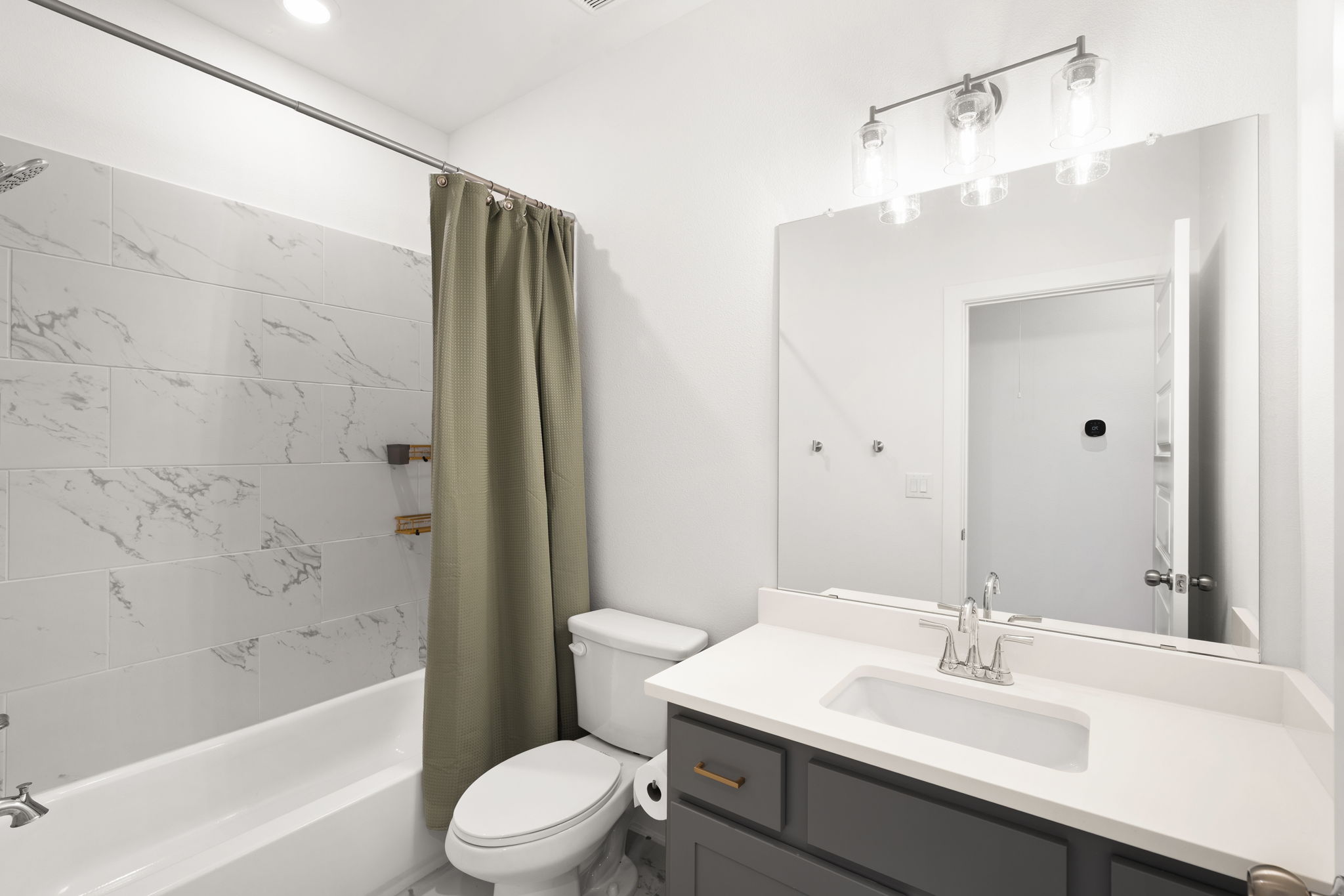 515 Watershield Cove Georgetown, TX 78633 - Photo 30 of 40 A well-appointed bathroom with a sleek vanity and modern fixtures for daily rejuvenation.