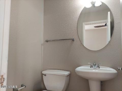 1505 East Chipman Road Phoenix, AZ 85040 - Photo 11 of 15 a bathroom with a sink toilet and a mirror