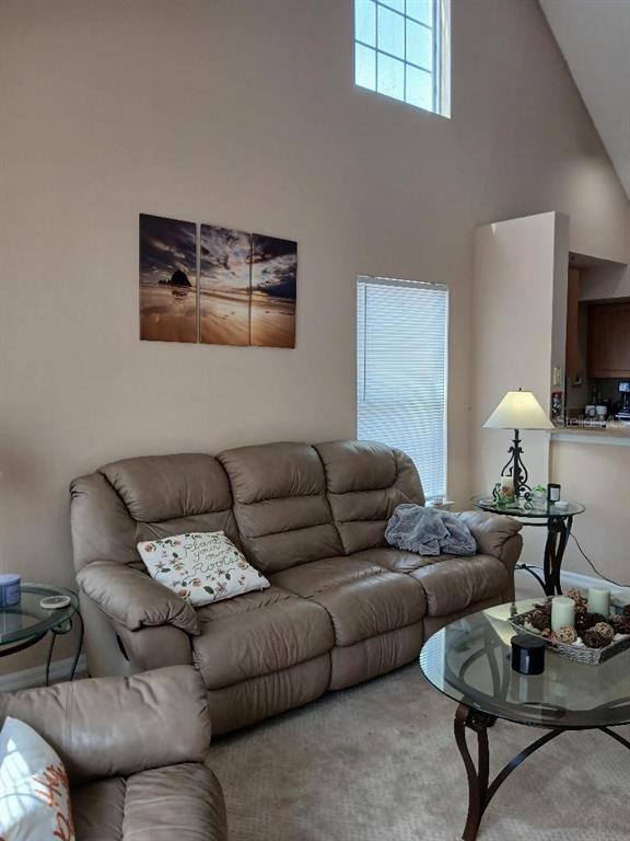5581 Rosehill Road, Unit 203 Sarasota, FL 34233 - Photo 14 of 17 a living room with furniture and a flat screen tv