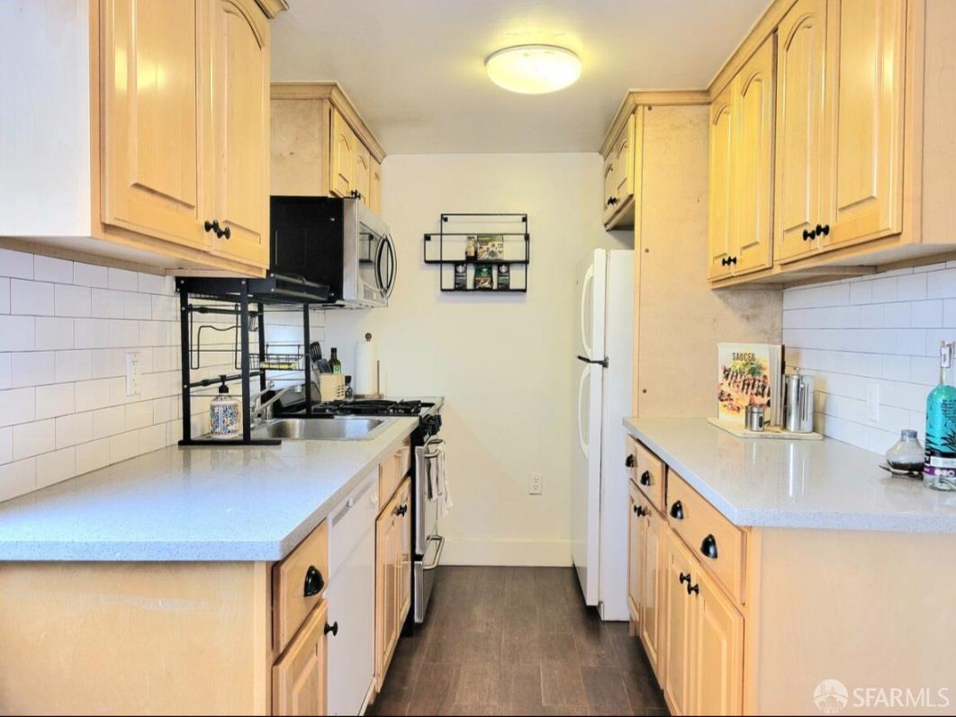 365 22nd Avenue San Francisco, CA 94121 - Photo 2 of 22 a kitchen with stainless steel appliances a sink stove and cabinets