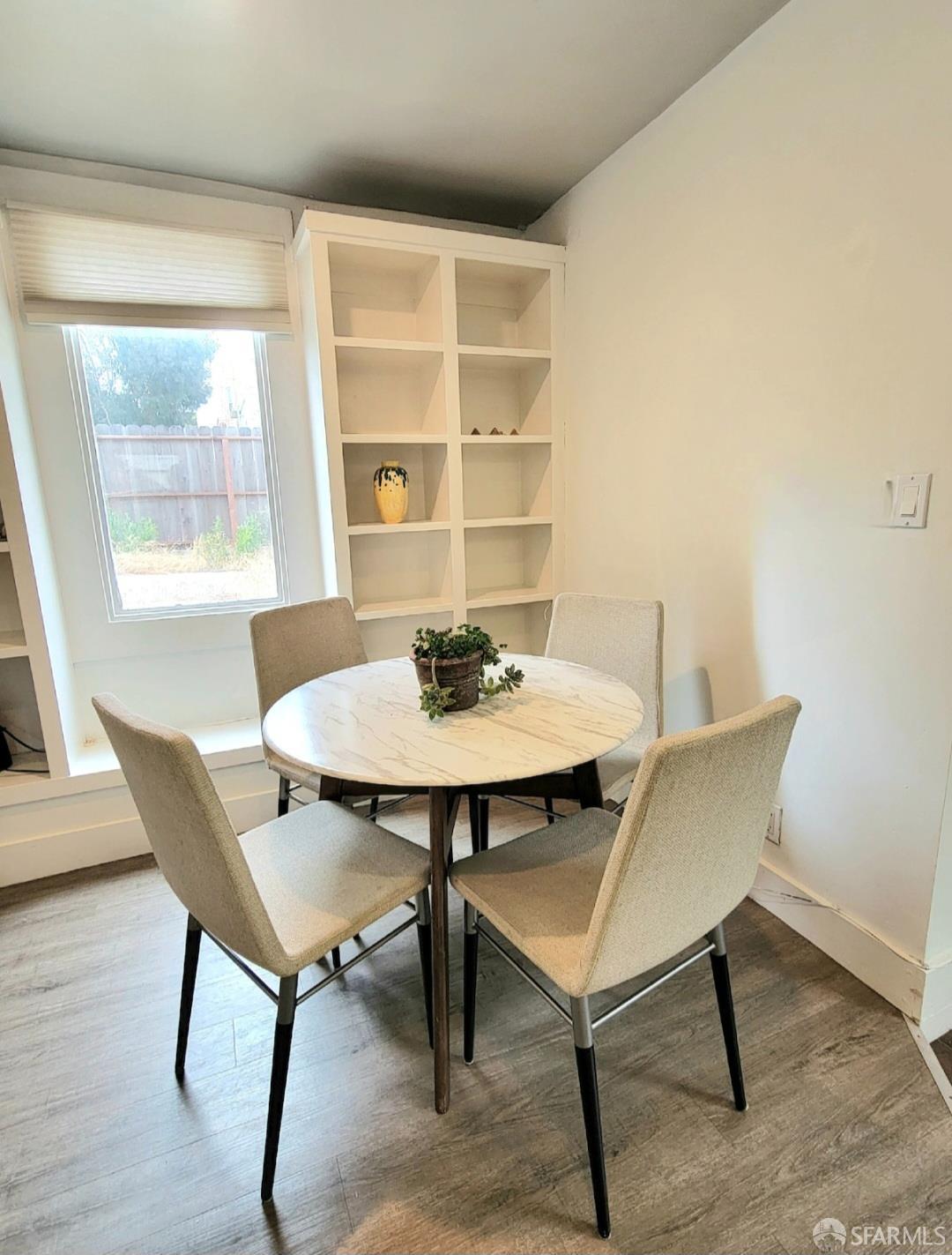 365 22nd Avenue San Francisco, CA 94121 - Photo 5 of 22 a view of a dining room with furniture window and wooden floor