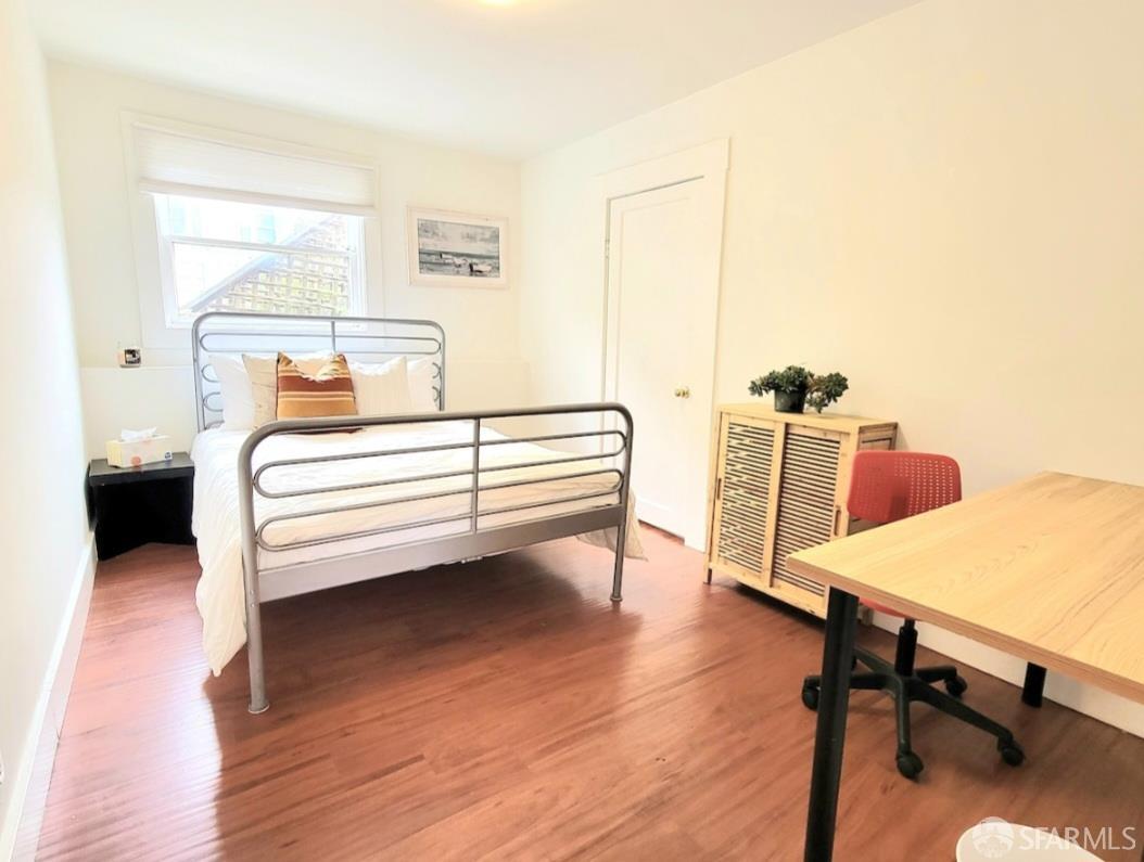 365 22nd Avenue San Francisco, CA 94121 - Photo 9 of 22 a bedroom with furniture and a wooden floor