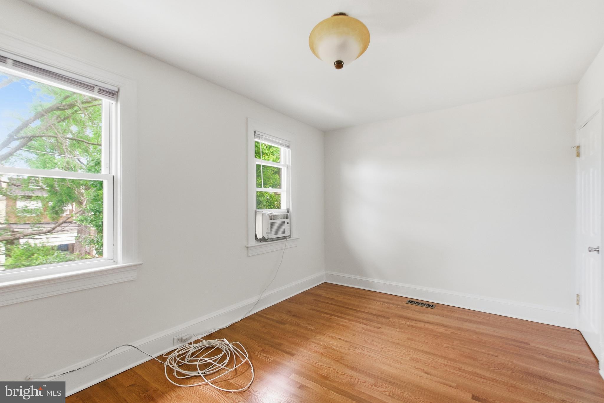 440 Delafield Place Northwest Washington, DC 20011 - Photo 21 of 33 a view of a room with wooden floor and windows