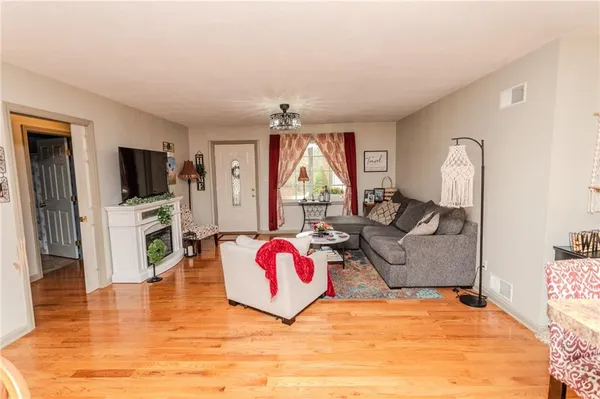 a bedroom with furniture and a flat screen tv