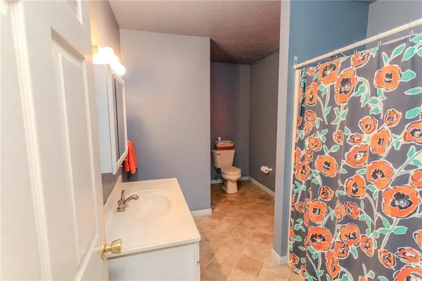 a utility room with a sink dryer and washer