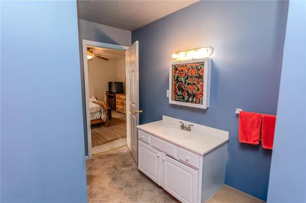 a view of a bathroom from the hallway