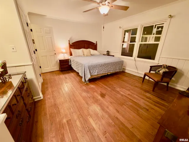 a living room with furniture a fireplace and a chandelier