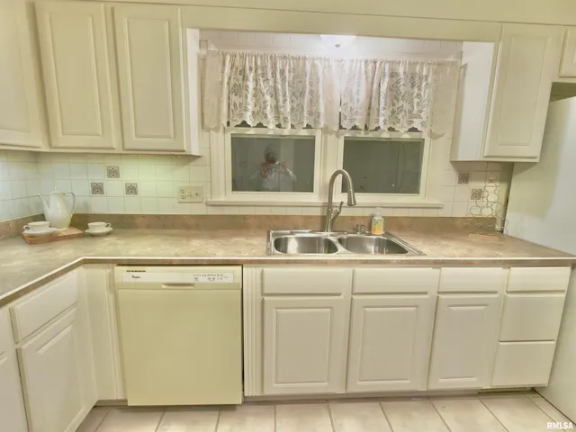 a view of a backyard with large trees