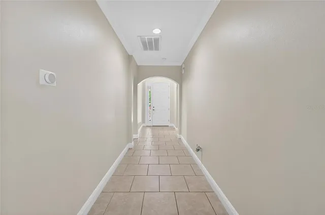 a bed room with a bed and a chandelier