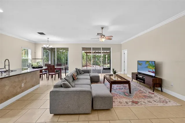 a bedroom with a bed and a tv on the dresser
