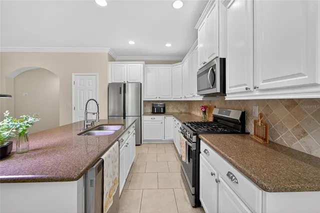 a kitchen with a sink and cabinets