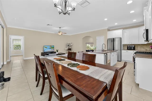 a bedroom with a bed and a book shelf