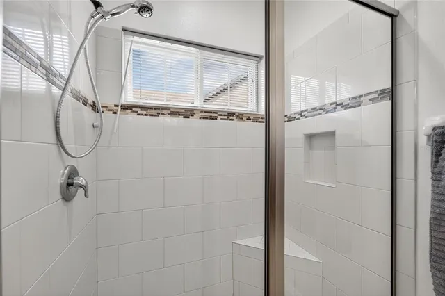 a view of room with wooden floor and shelves