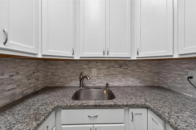 a bedroom with a bed and a book shelf