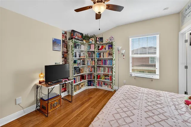 an aerial view of a house with garden space and street view