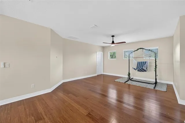 an aerial view of a house with a yard and lake view