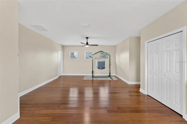 an aerial view of a house with swimming pool patio and lake view