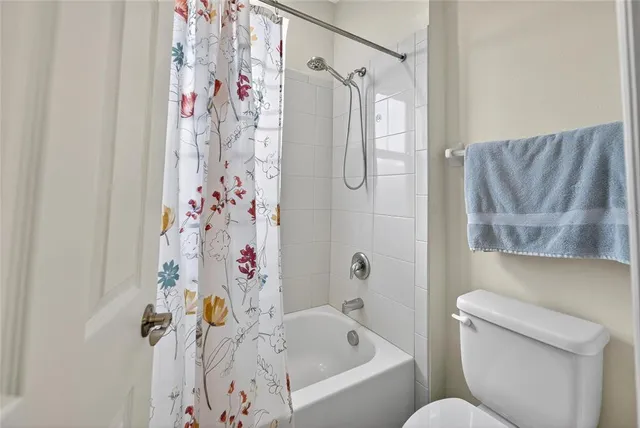 an aerial view of a house with a swimming pool