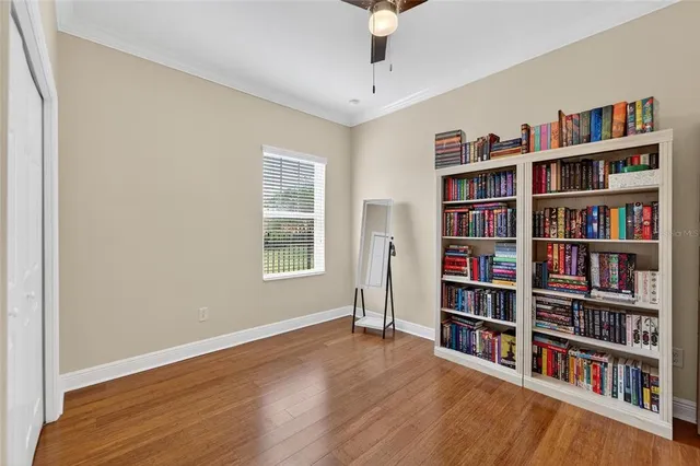 an aerial view of a residential houses with outdoor space and lake view