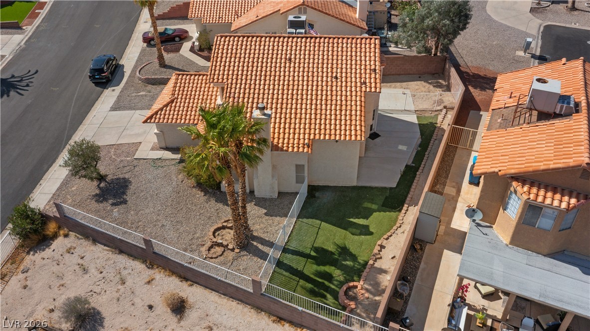 3156 Terrace View Drive Laughlin, NV 89029 - Photo 80 of 94 An aerial perspective reveals a vibrant tiled roof on this desert dwelling, framed by lush palm trees and a low-maintenance yard.