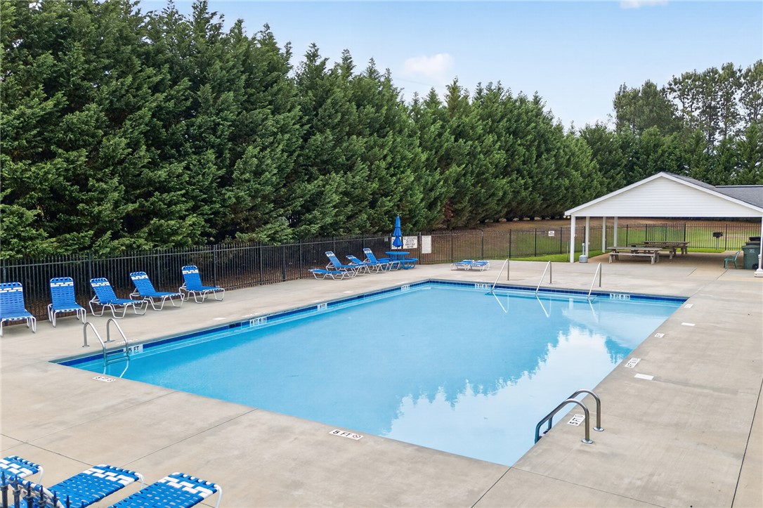 207 Hunters Lane Anderson, SC 29625 - Photo 35 of 46 A sparkling community pool invites relaxation with ample lounge seating and a covered picnic area. This is just a short walk down Hunters Lane from your new home.