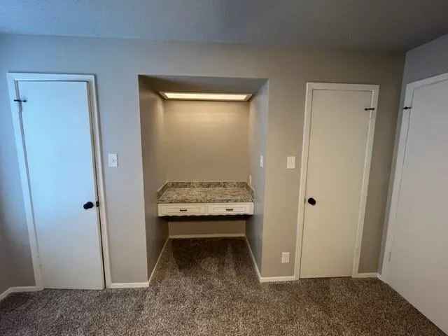 a room that has a bed and a door in it