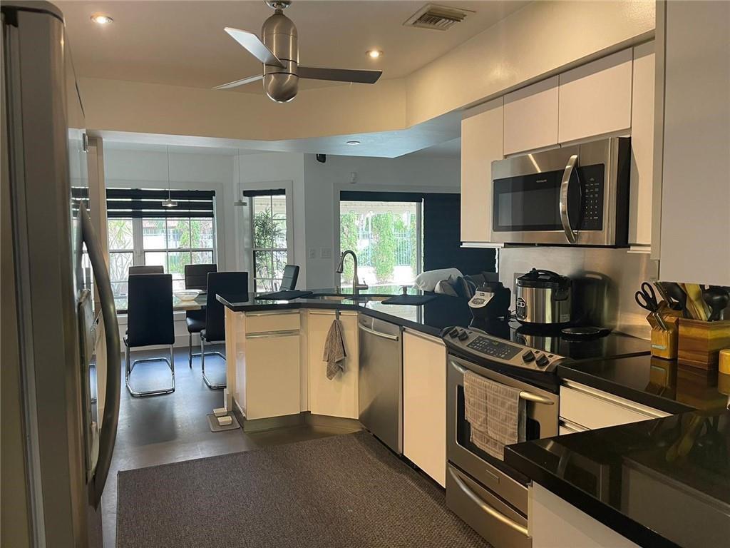 21723 Club Villa Terrace Boca Raton, FL 33433 - Photo 14 of 32 a kitchen with a sink appliances and cabinets