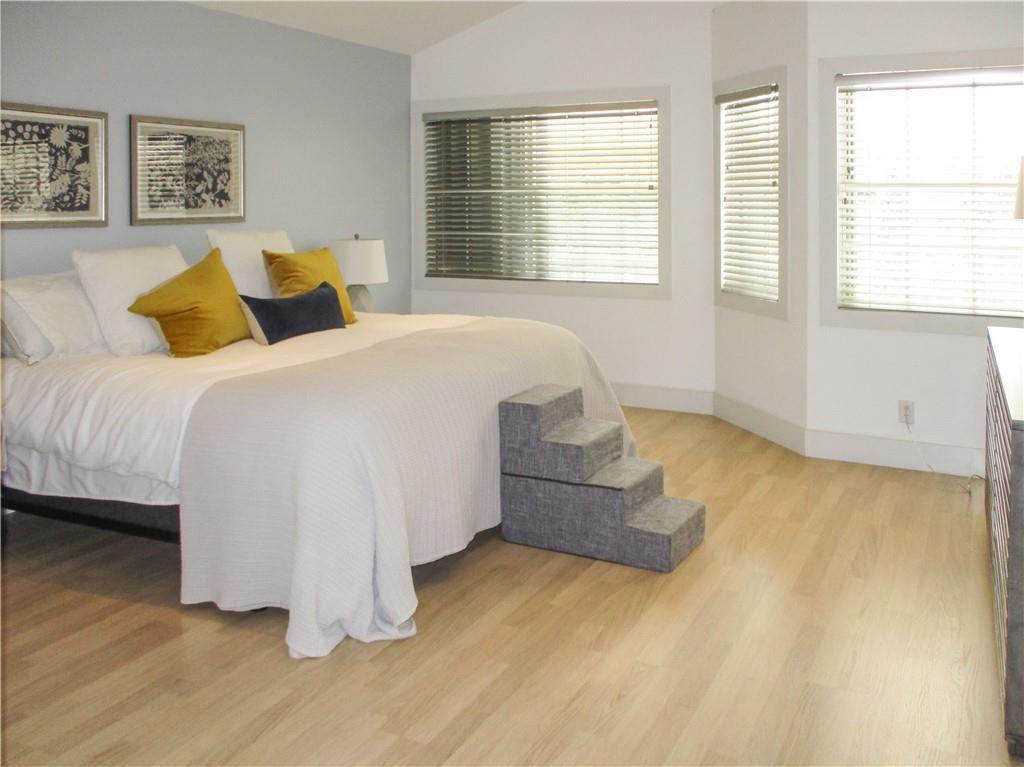 21723 Club Villa Terrace Boca Raton, FL 33433 - Photo 27 of 32 a bedroom with a bed and wooden floor