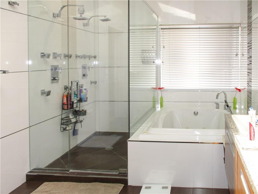 21723 Club Villa Terrace Boca Raton, FL 33433 - Photo 29 of 32 a bathroom with a bathtub and a window