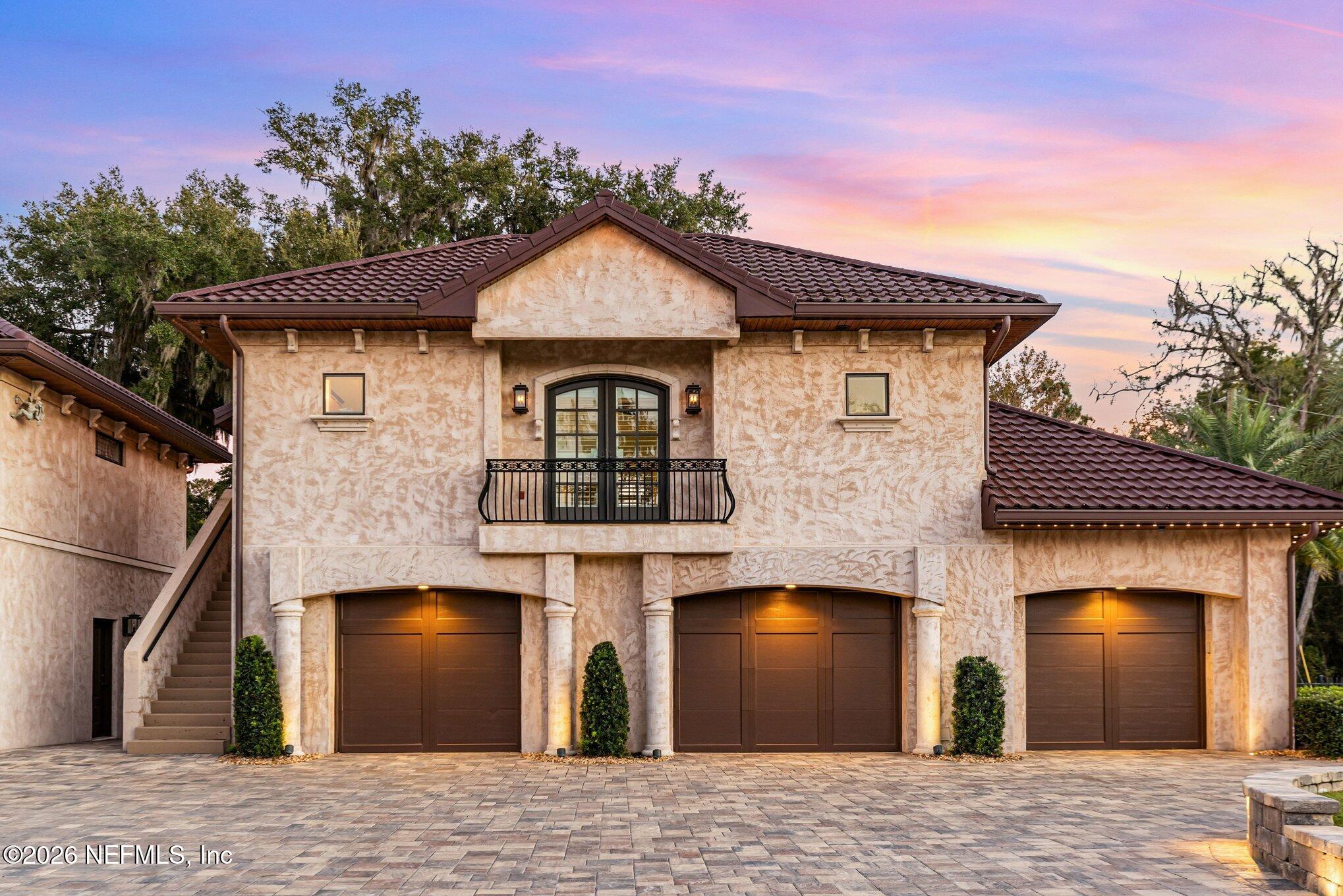 1402 Wilkies Point Road Green Cove Springs, FL 32043 - Photo 13 of 95 a front view of a house with a garden