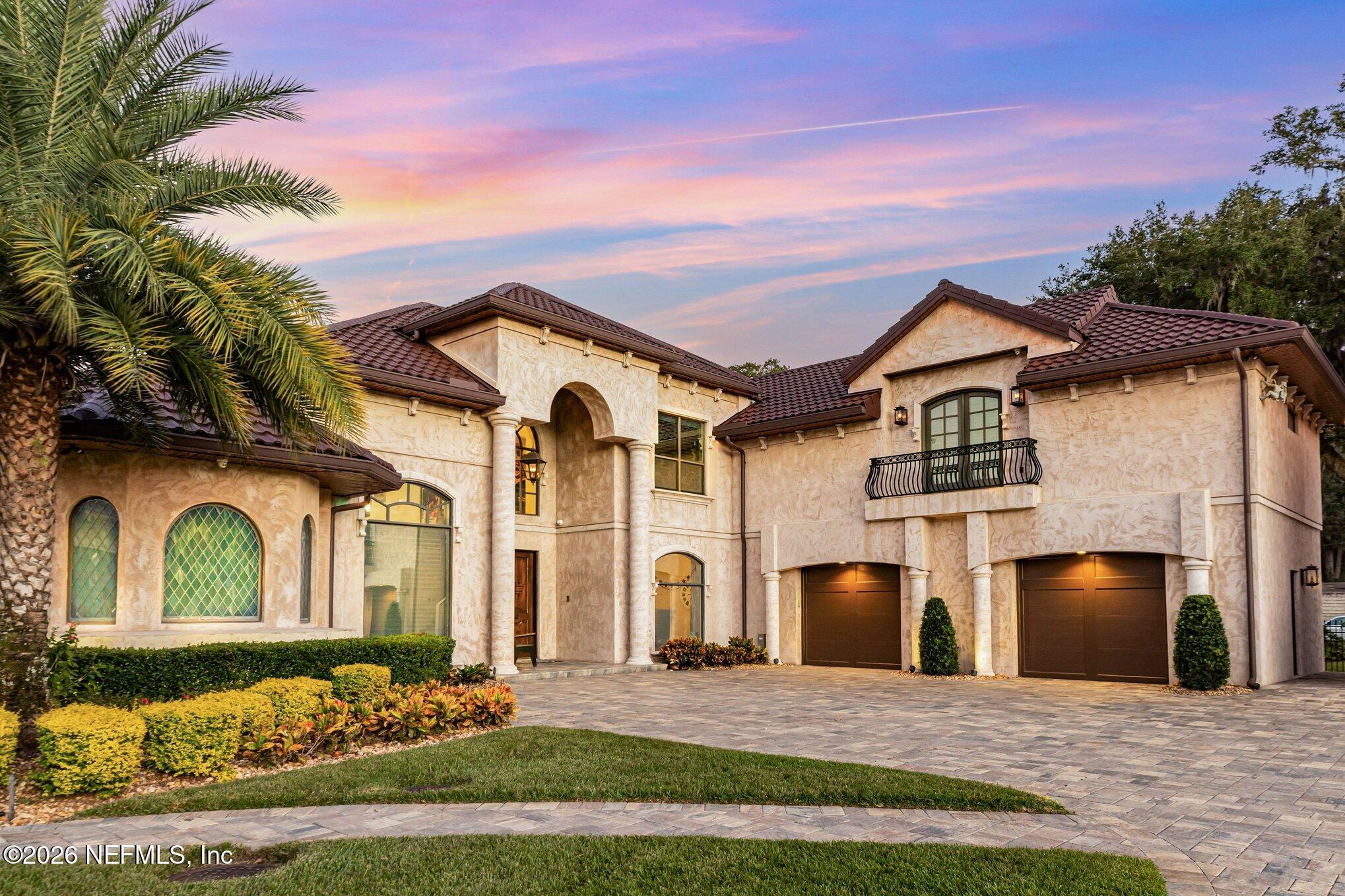 1402 Wilkies Point Road Green Cove Springs, FL 32043 - Photo 17 of 95 a front view of a house with a yard