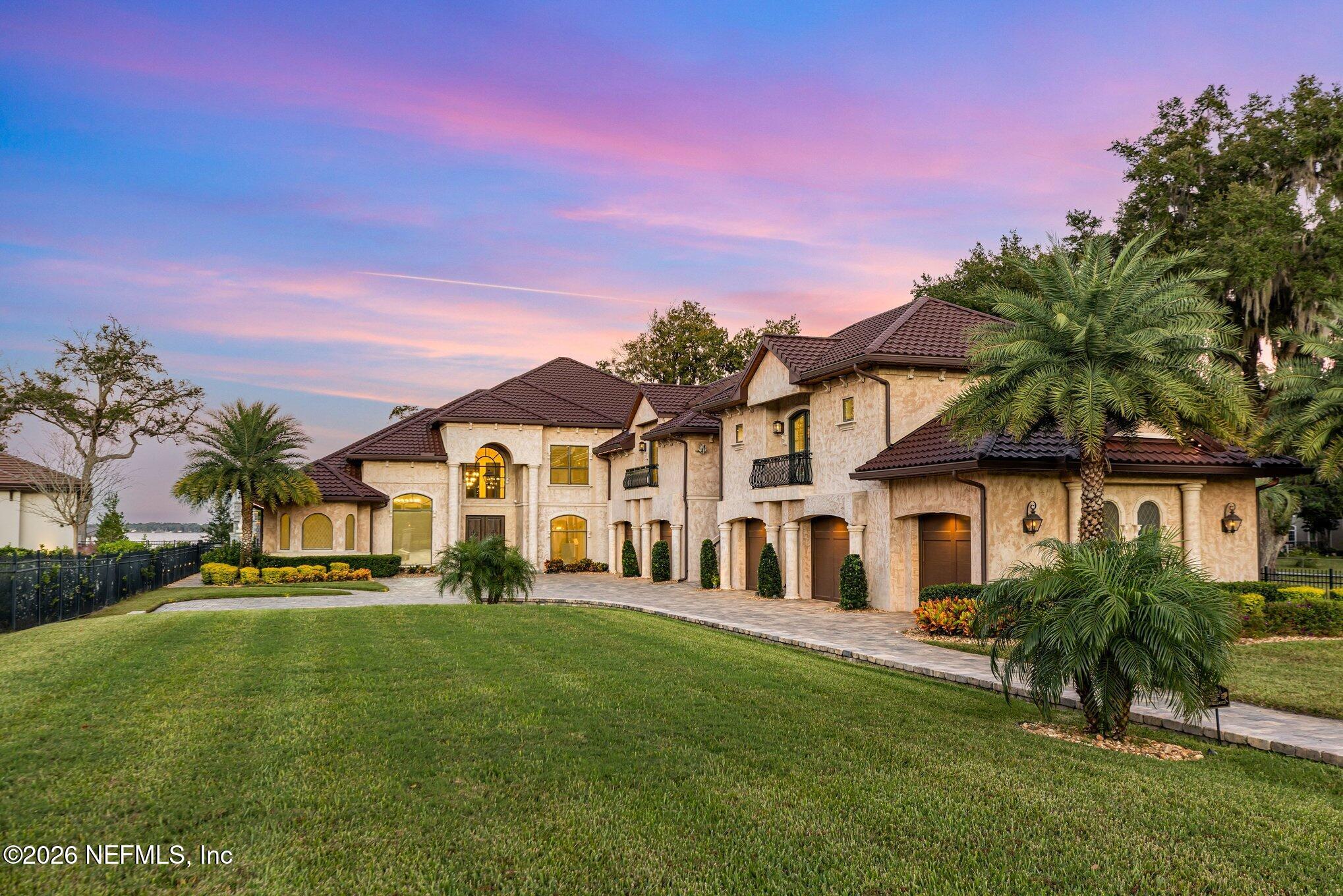1402 Wilkies Point Road Green Cove Springs, FL 32043 - Photo 18 of 95 a front view of a house with a yard