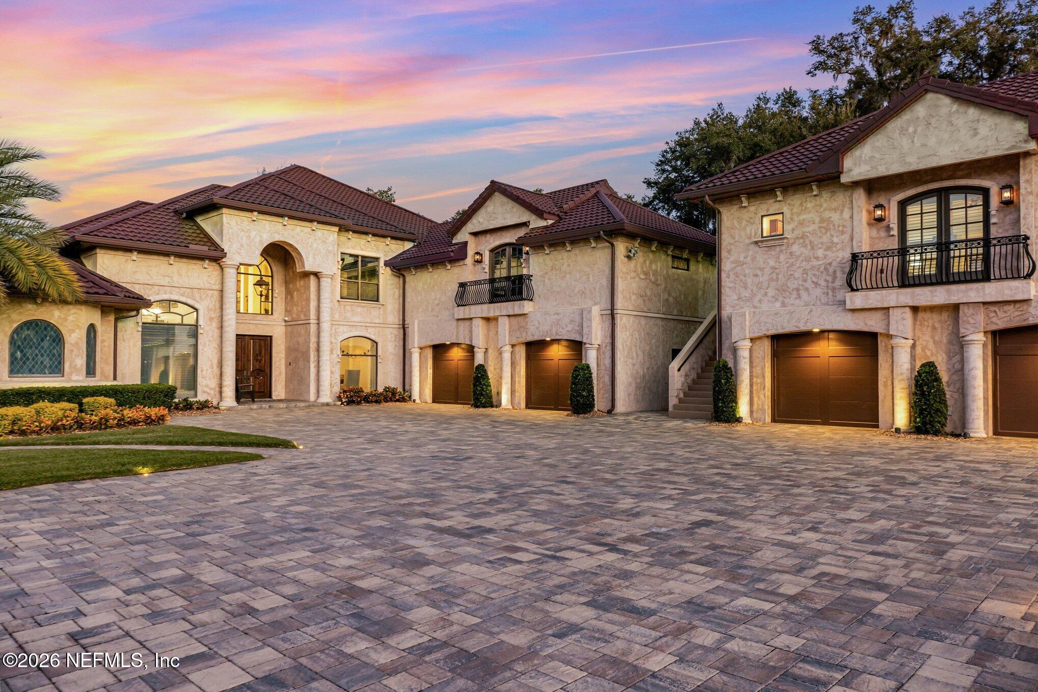 1402 Wilkies Point Road Green Cove Springs, FL 32043 - Photo 2 of 95 a front view of a house with a yard and garage