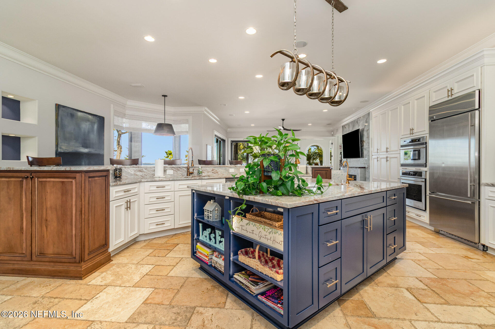 1402 Wilkies Point Road Green Cove Springs, FL 32043 - Photo 32 of 95 a kitchen with stainless steel appliances granite countertop a stove a refrigerator and a center island