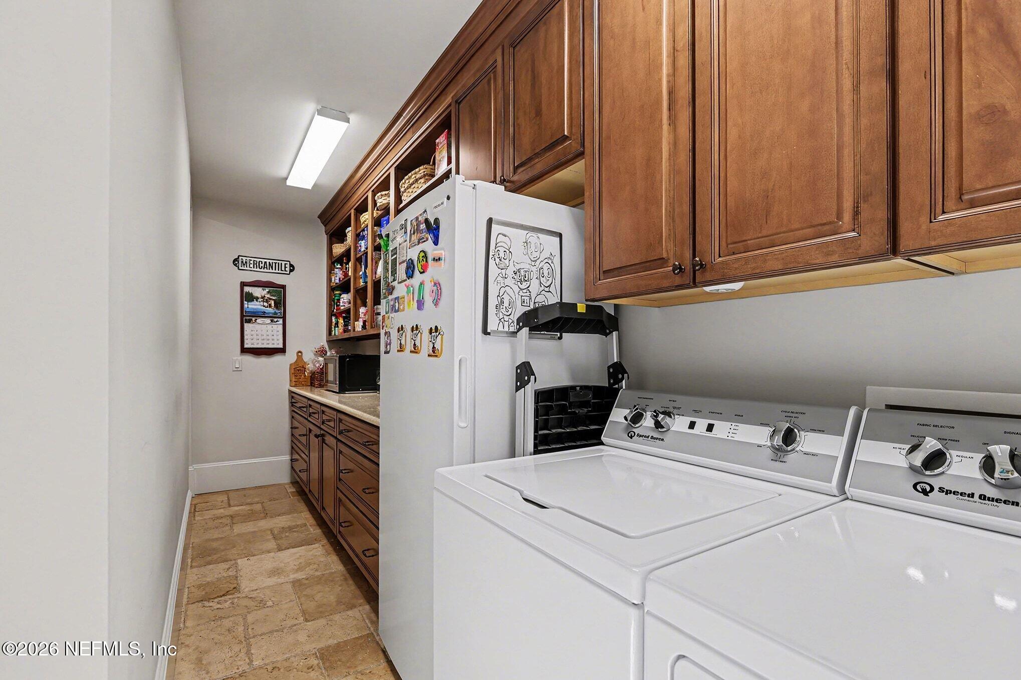 1402 Wilkies Point Road Green Cove Springs, FL 32043 - Photo 37 of 95 a utility room with dryer and washer