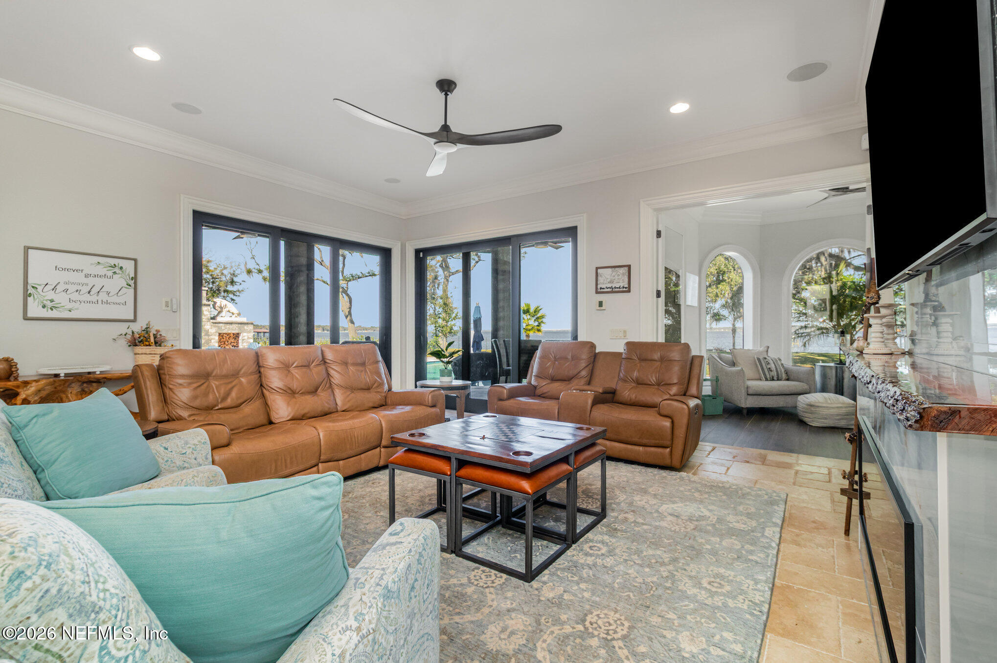 1402 Wilkies Point Road Green Cove Springs, FL 32043 - Photo 41 of 95 a living room with furniture and a flat screen tv