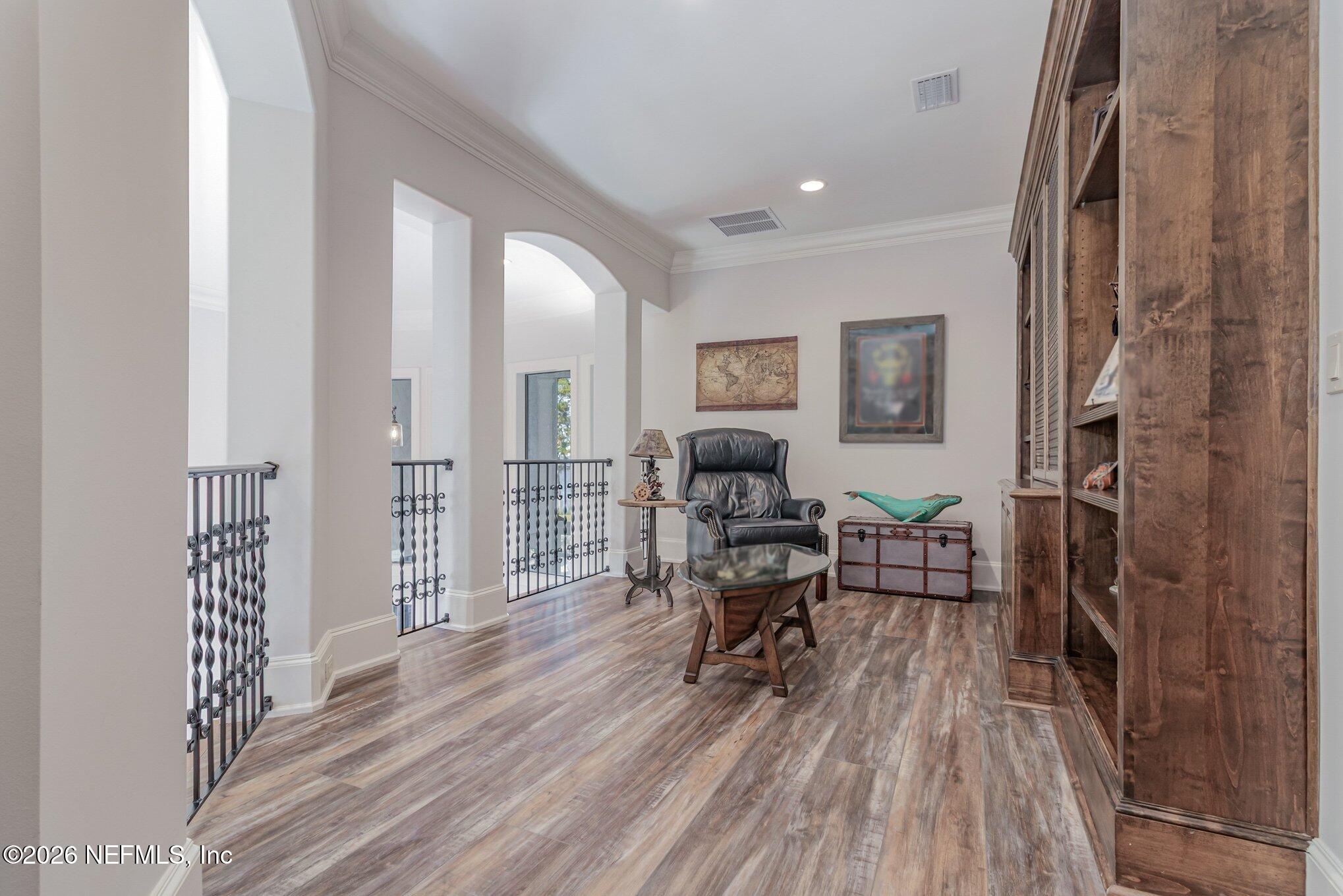 1402 Wilkies Point Road Green Cove Springs, FL 32043 - Photo 61 of 95 a living room with furniture and a wooden floor