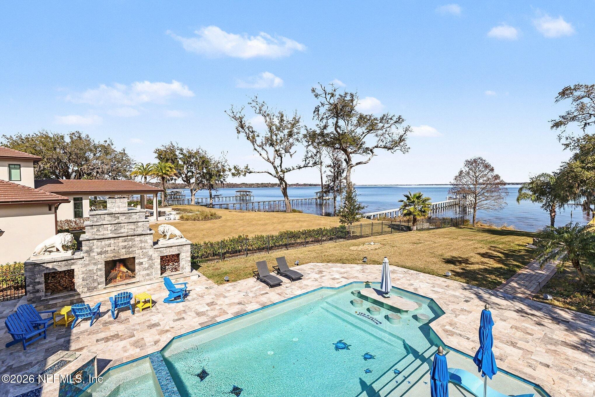 1402 Wilkies Point Road Green Cove Springs, FL 32043 - Photo 76 of 95 a view of a swimming pool with a patio