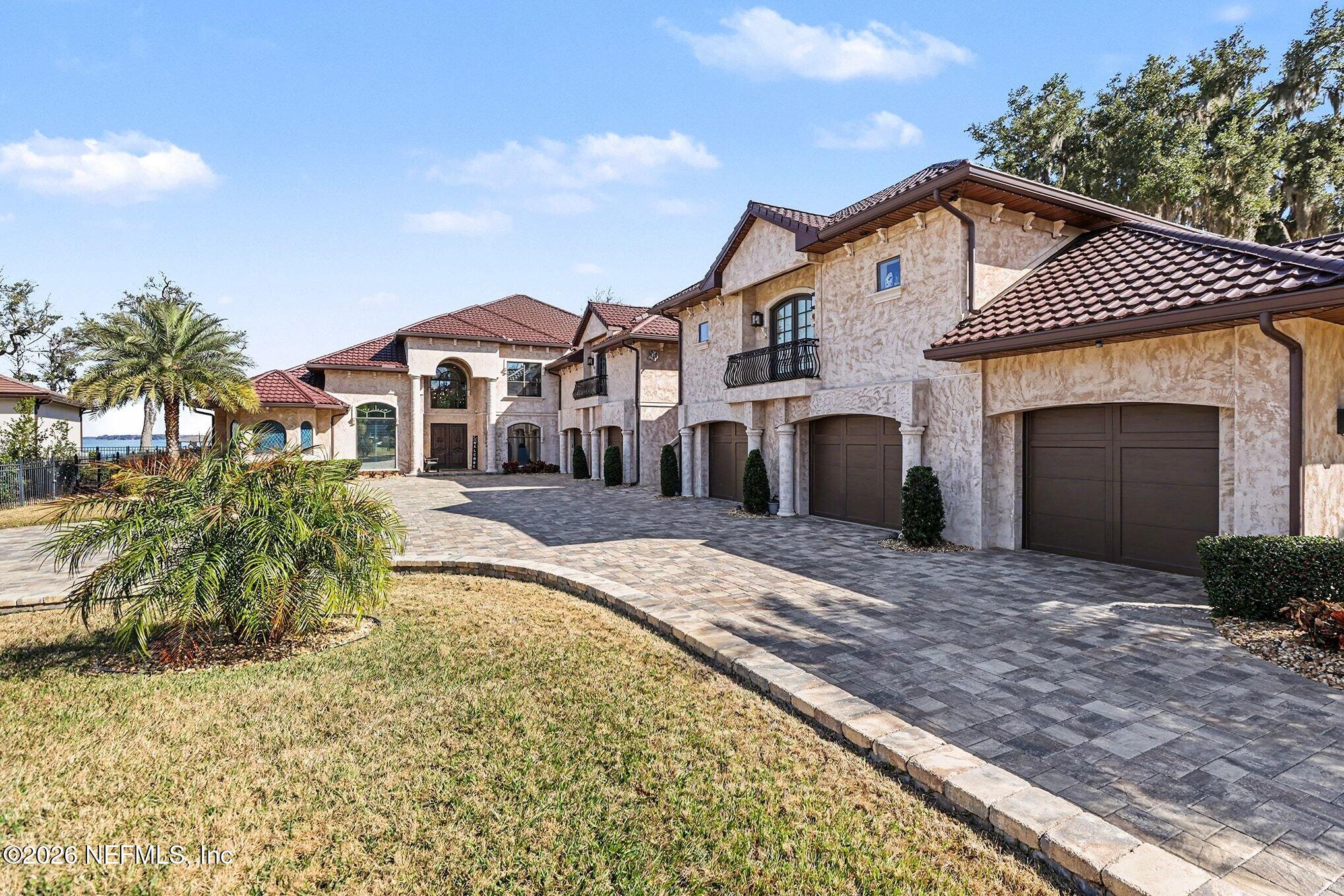 1402 Wilkies Point Road Green Cove Springs, FL 32043 - Photo 87 of 95 a front view of a house with a yard