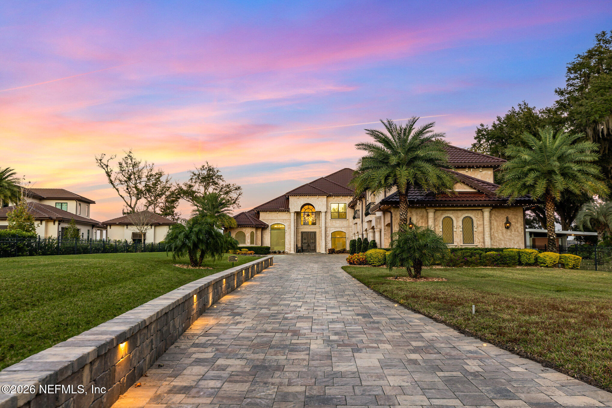 1402 Wilkies Point Road Green Cove Springs, FL 32043 - Photo 88 of 95 a front view of a house with a yard and trees