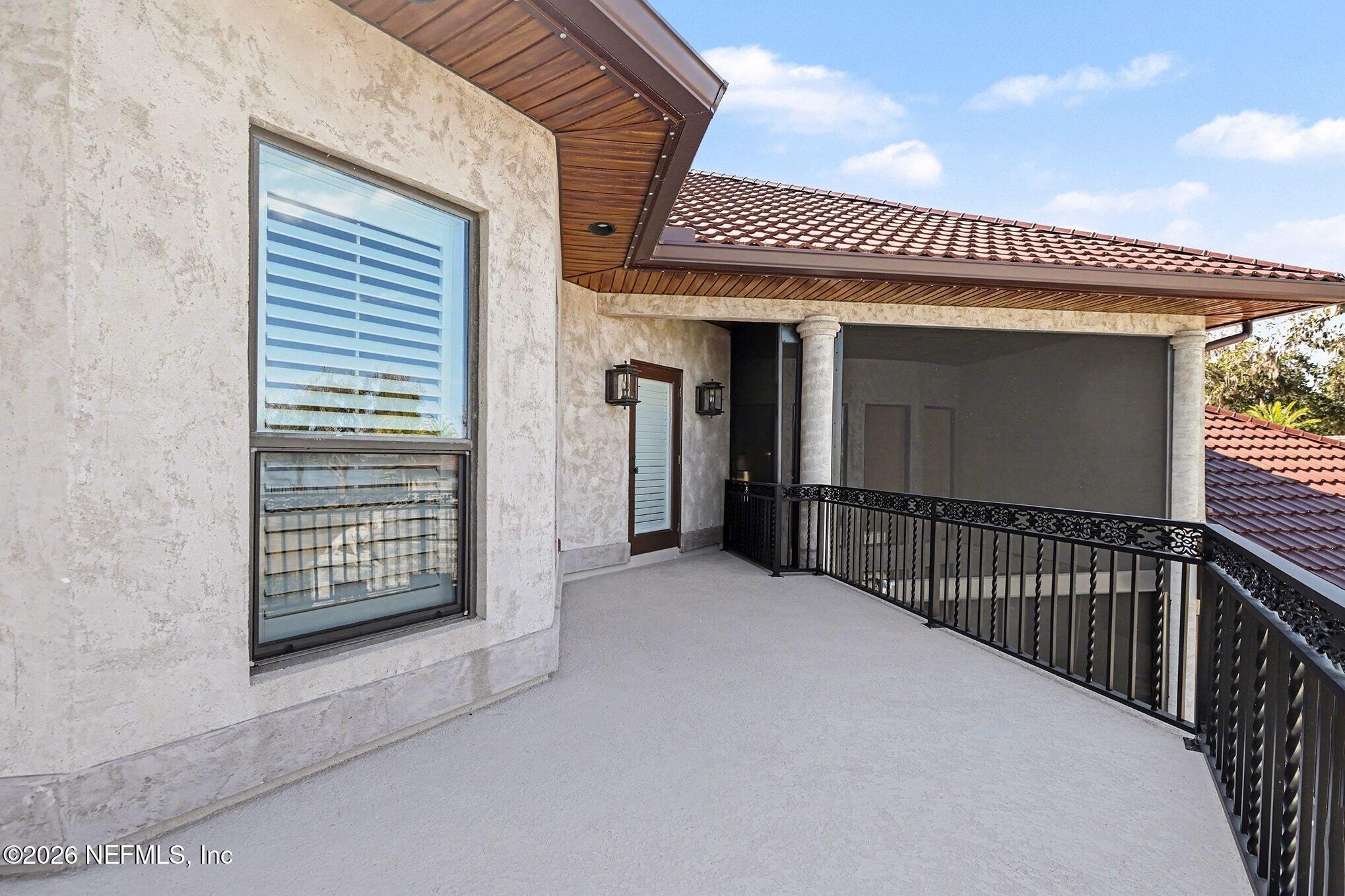 1402 Wilkies Point Road Green Cove Springs, FL 32043 - Photo 90 of 95 a view of a porch with wooden floor and fence
