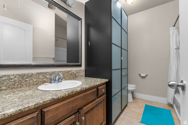 476 West 200 N Street, Unit 206 Springville, UT 84663 - Photo 16 of 24 Bathroom with vanity, light tile patterned floors, and shower / bathtub combination with curtain