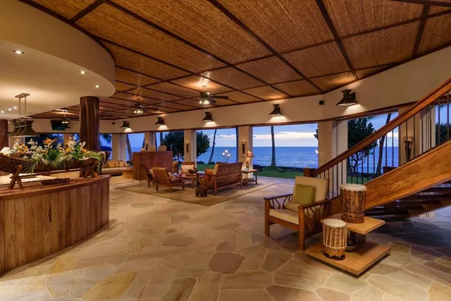 a view of a chairs and tables in the back yard of the house