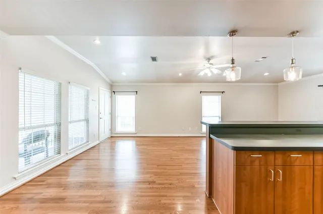 a kitchen with stainless steel appliances granite countertop a sink stove and cabinets