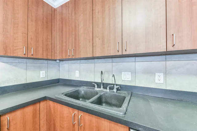 a view of cabinets and wooden floor