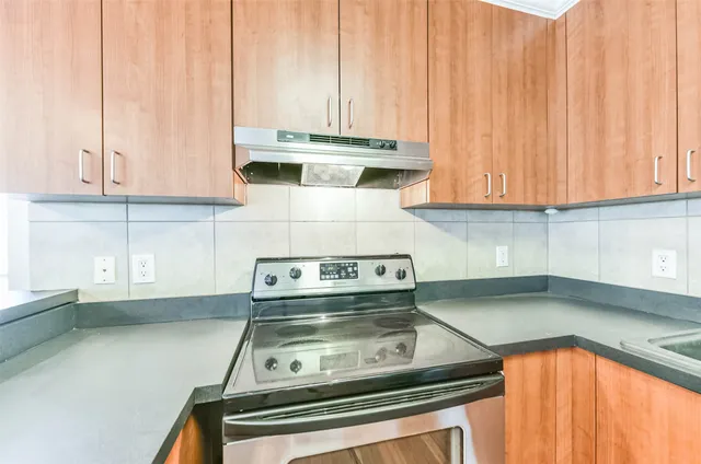 a kitchen with a sink cabinets and utility